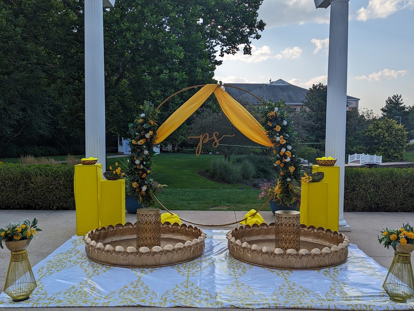 Circular wedding arch with custom initials, decorated for an outdoor event in Springmill Manor venue