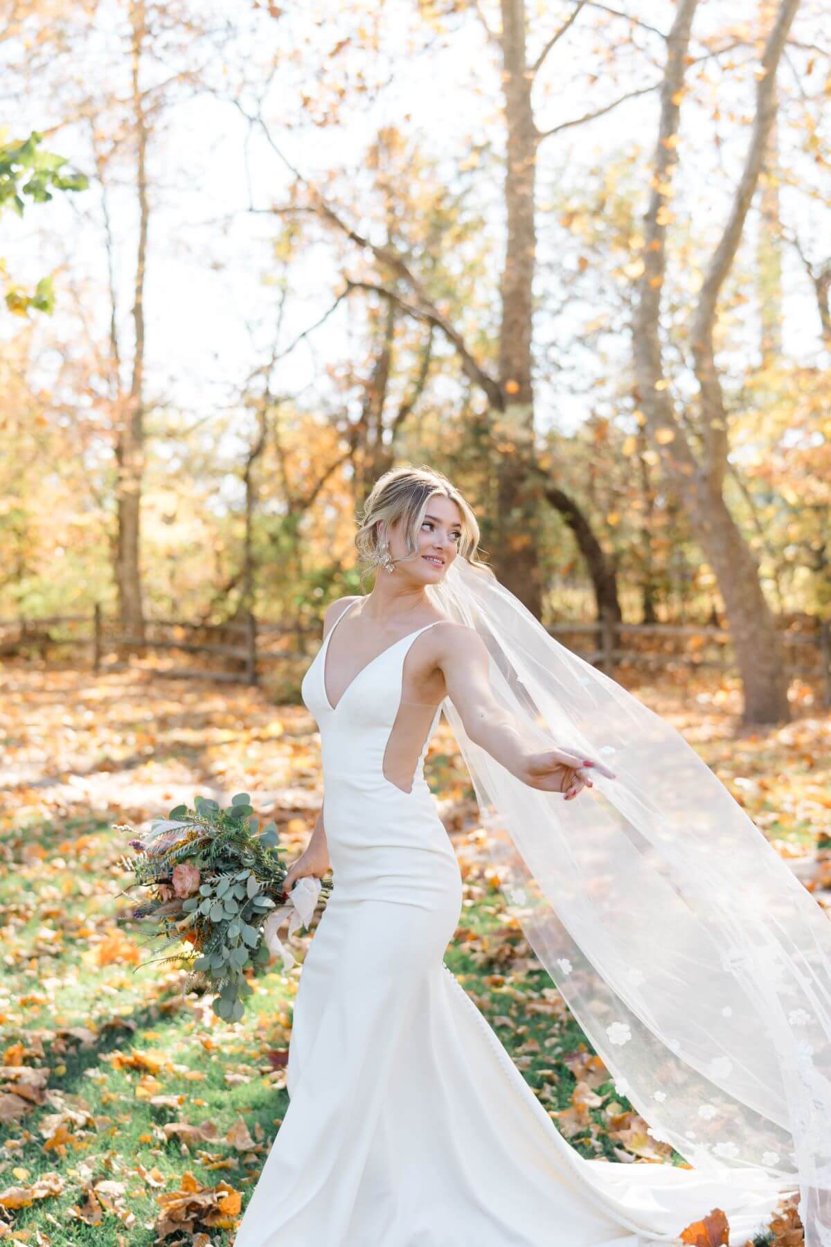 Wedding bride in a contemporary gown,captured in Springmill Manor venue natural backdrop.